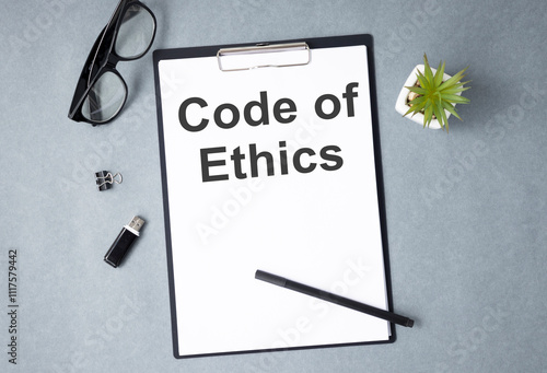 Code of Ethics text on notebook. Concept of ethical integrity, value and ethics.