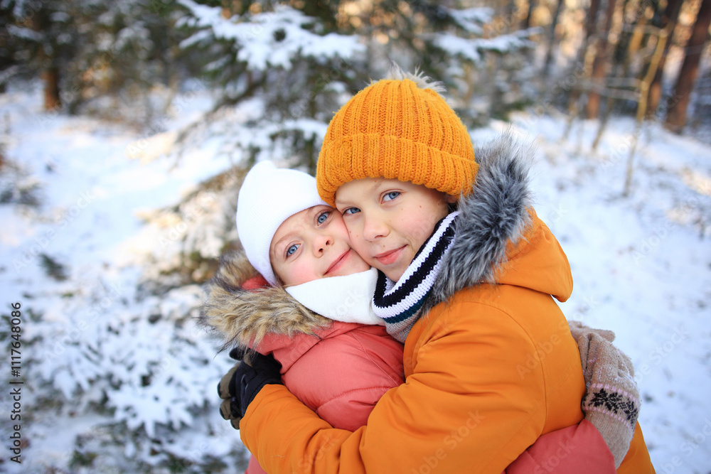 A heartwarming scene captures a brother and sister joyfully embracing while walking through a picturesque snowy forest. A heartwarming scene captures a brother and sister joyfully embracing while walking through a picturesque snowy forest.