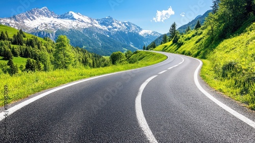 Scenic winding road through green hills and mountains 