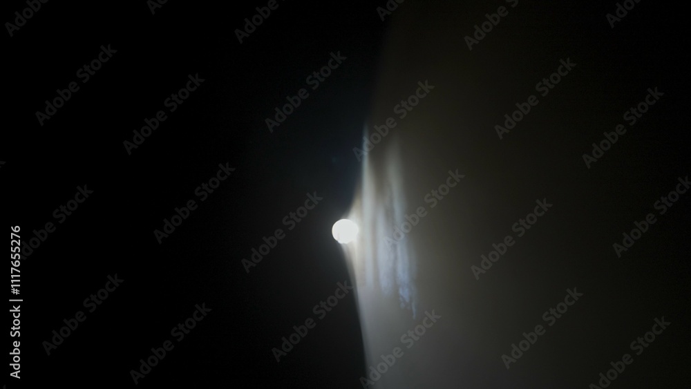 Bright white spotlights rays of professional lighting equipment flashing in darkness on black background on right corner with smoke floating up. Bright white spotlights rays of professional lighting equipment flashing in darkness on black background on right corner with smoke floating up.
