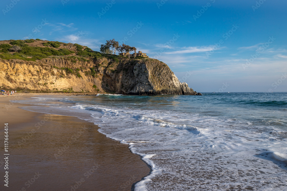 Waves lap at Crystal Cove Beach