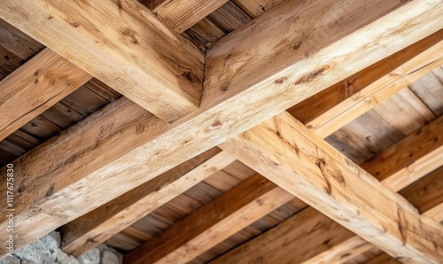 Wooden beams and ceiling structure in a rustic setting.