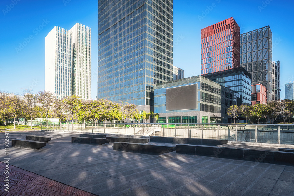 Skyscrapers and Blue Sky Over Urban Park and Walkway Skyscrapers and Blue Sky Over Urban Park and Walkway