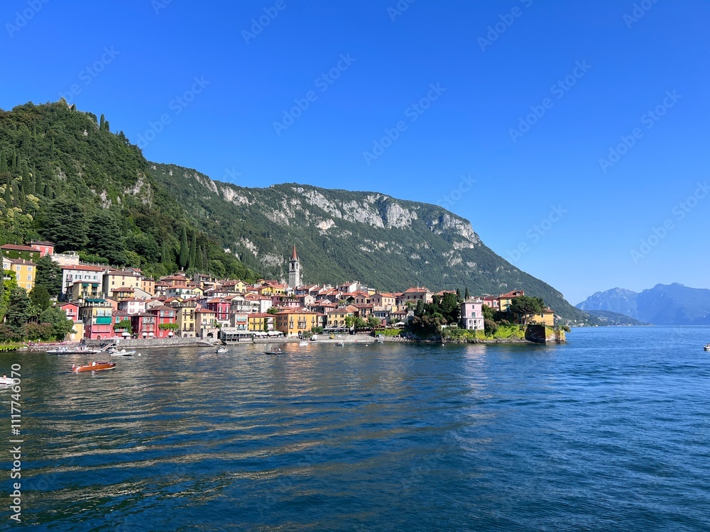 Sunny day in Varenna Lombardy from ferry, mountains and Como lake Sunny day in Varenna Lombardy from ferry, mountains and Como lake