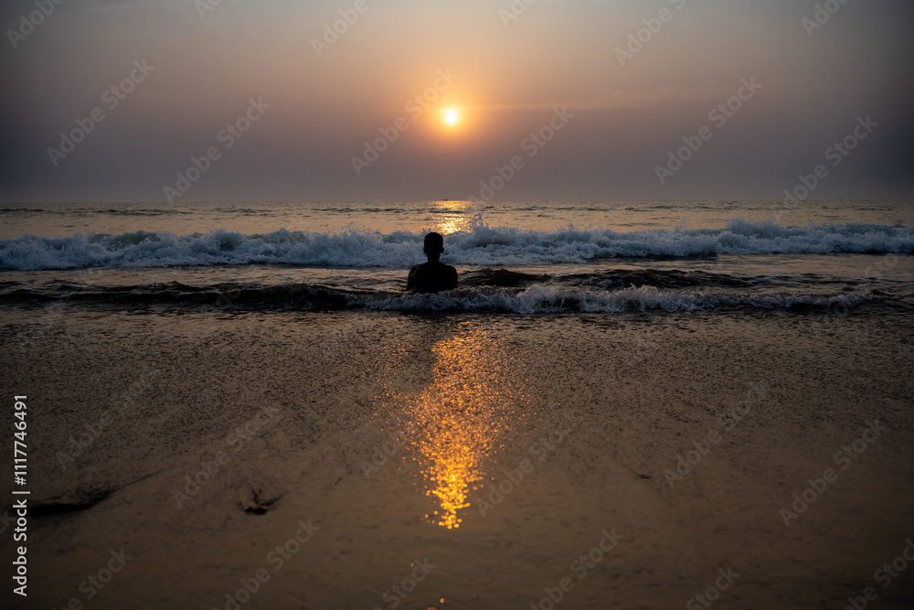 Fototapeta premium boy enjoying on shore at beach during sunny day