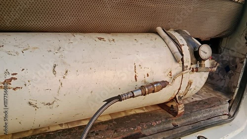 Car refilling CNG in Pakistan