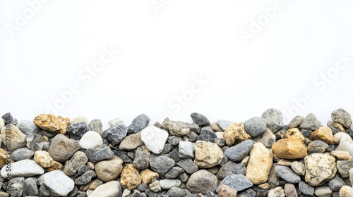 A collection of assorted smooth stones arranged on a white background, showcasing a variety of textures, colors, and sizes.