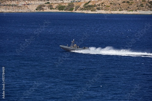 A Greek Coast Guard inflatable boat at full speed near the Attica coast