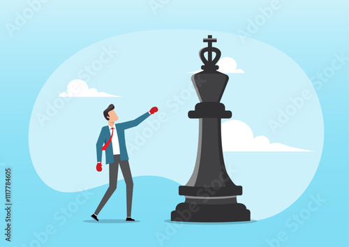 businessman with boxing glove fight with big chess king