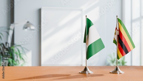 FLAGS OF NIGERIA AND ZIMBABWE ON TABLE photo