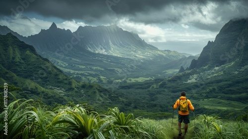 A person with a backpack standing on a mountain top, great for outdoor adventure or travel themes photo