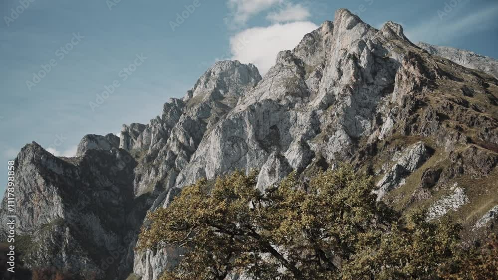 Rocky mountains of Picos de Europa with clouds above, handheld Rocky mountains of Picos de Europa with clouds above, handheld