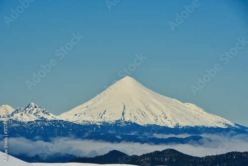 calbuco vulcano Chile winter snow caped panorama ski mountain blue sky