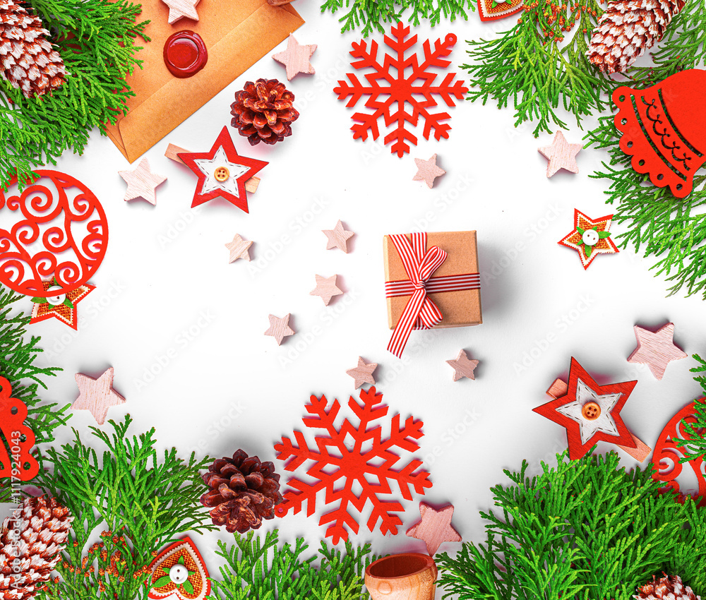Christmas background. Christmas eve concept. Top view of gift boxes, fir branches, toys, on white background.