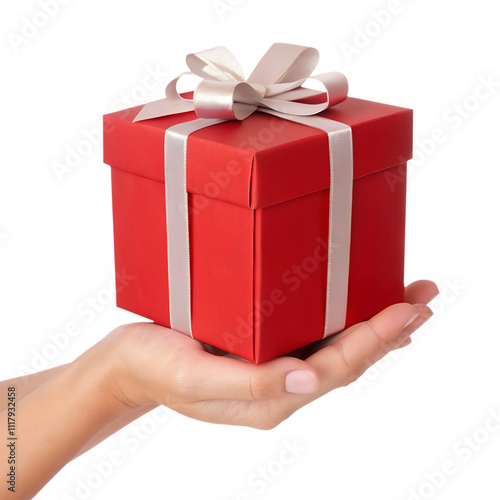 Hand holding red gift box with a white ribbon isolated on a transparent background