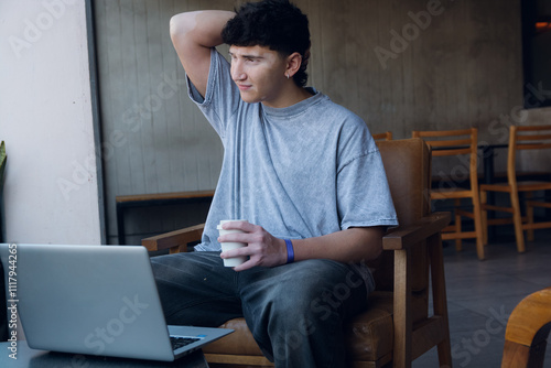 Young man frustrated by the money lost in his digital assets