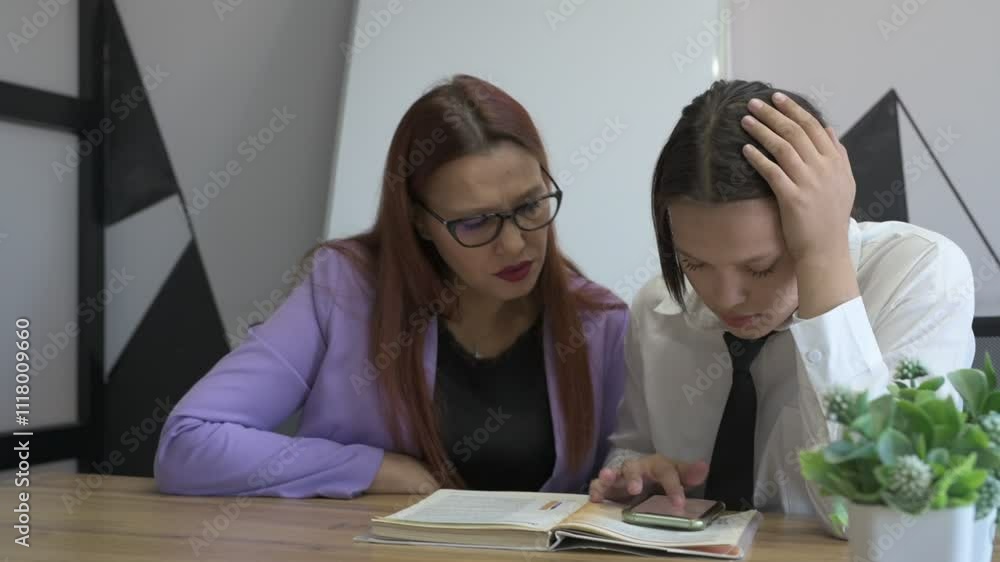Schoolgirl and teacher have a lesson in the office, private lessons, distance learning Schoolgirl and teacher have a lesson in the office, private lessons, distance learning