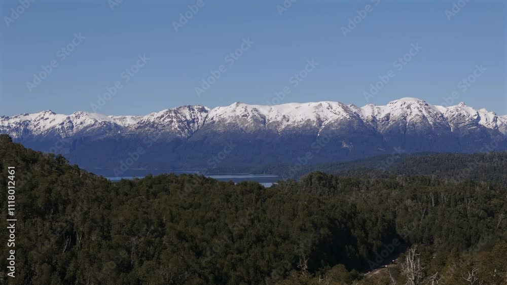 Aerial view of impressive snow-capped mountains on the Seven Lakes Route in Patagonia, Argentina. Aerial view of impressive snow-capped mountains on the Seven Lakes Route in Patagonia, Argentina.
