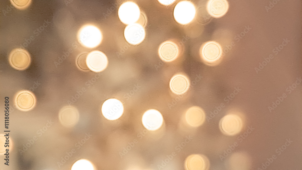 Fototapeta premium Blurred golden and light brown bokeh background with soft Christmas lights.