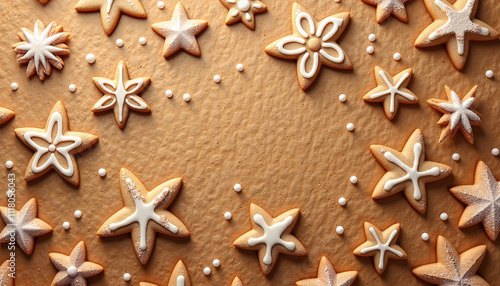 Delicious gingerbread cookies with white icing decorations and sugar sprinkles on a brown background