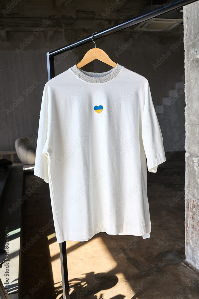 White t-shirt with Ukrainian heart on a hanger