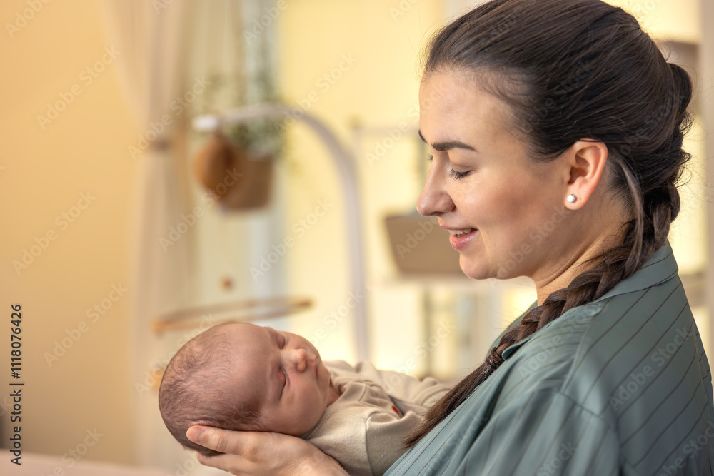 A young mother with a newborn baby. Newborn baby. A young mother with a newborn baby. Newborn baby.