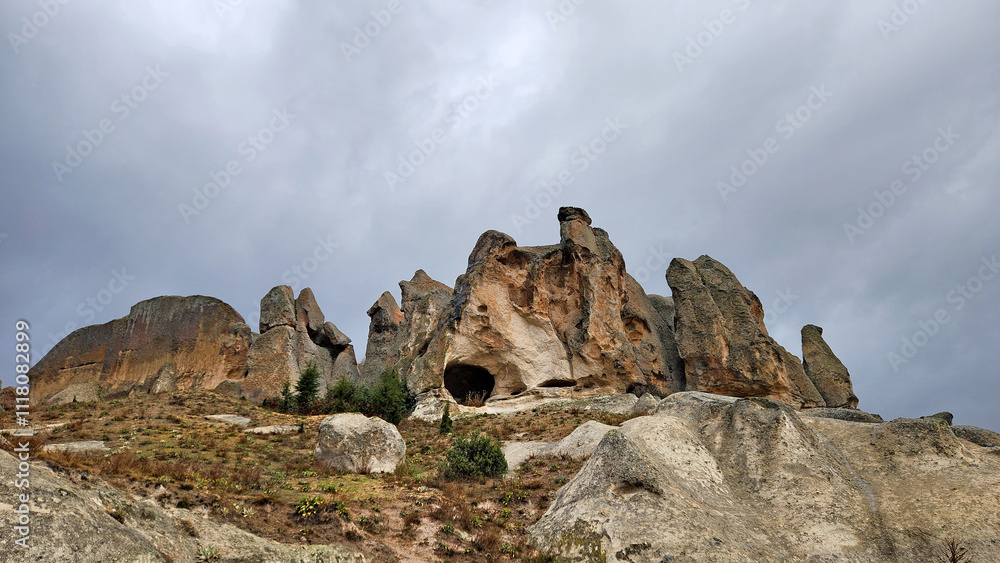 Rock-carved Mythological Wine Storage in Uclerkayasi village in Ihsaniye districf of Afyonkarahisar prpvince in the evening of a rainy autumn day Rock-carved Mythological Wine Storage in Uclerkayasi village in Ihsaniye districf of Afyonkarahisar prpvince in the evening of a rainy autumn day