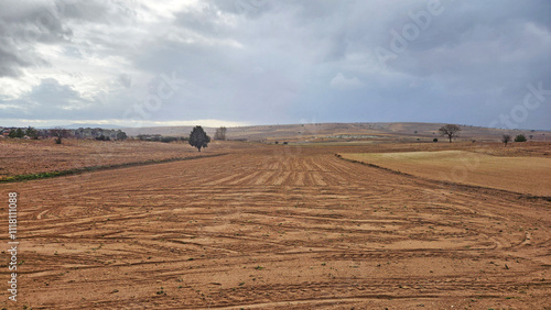 Colorful crop field in the west of famous Aslankaya Phyrgian Monument by the side of road to Doger town in Afyonkarahisar province in the evening of a severe rainy autumn day photo