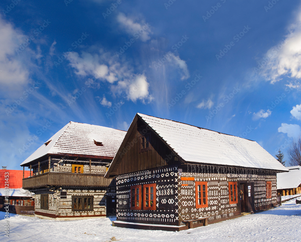 Unique decoration of log houses based on patterns used in traditional embroidery in village of Cicmany village, Slovakia