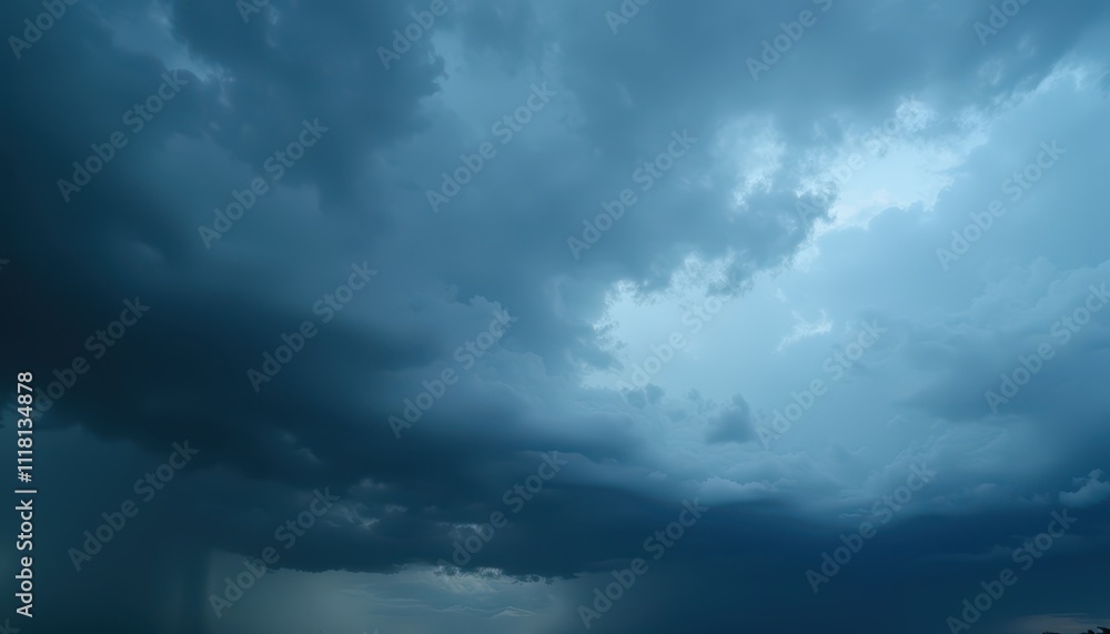 Fototapeta premium Dark and moody cloudy sky with dramatic blue tones, creating a mysterious and atmospheric view of the approaching storm