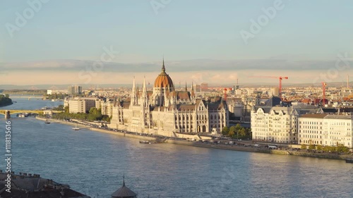 Breathtaking view of the Hungarian Parliament under a sunset sky, reflecting the beauty of Budapest as the Dnube river