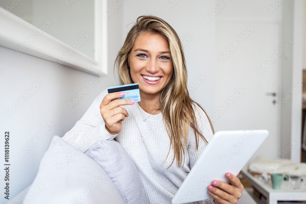 Smiling Woman Holding Credit Card and Tablet for Online Shopping Smiling Woman Holding Credit Card and Tablet for Online Shopping
