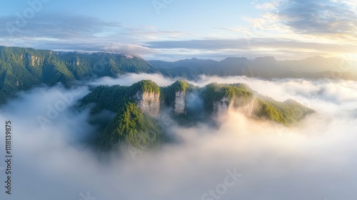 The sky is cloudy and the mountains are covered in fog