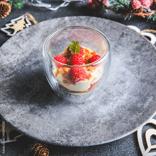 Obraz na płótnie Verrine of crushed speculoos, mascarpone and raspberries on a gray background decorated for Christmas w salonie
