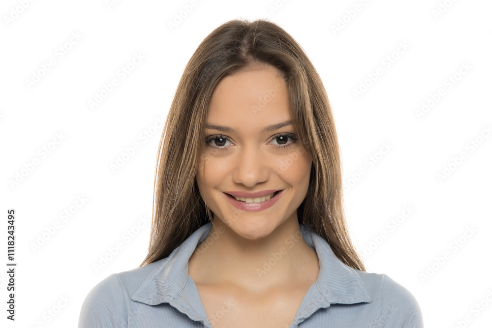 Portrait of a beautiful young smiling woman with makeup on a white studio background Portrait of a beautiful young smiling woman with makeup on a white studio background