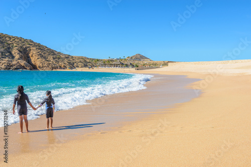 Santa Maria Beach, Cabo San Lucas, Mexico. Different stages of the fantastic ocean waves. Rocky and sandy beach. photo