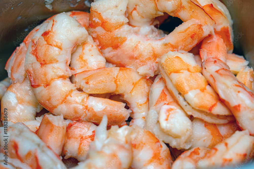 Juicy shrimp are freshly cooked and piled up, showcasing their vibrant colors, ideal for culinary creations or seafood dishes during dinner Juicy shrimp are freshly cooked and piled up, showcasing their vibrant colors, ideal for culinary creations or seafood dishes during dinner