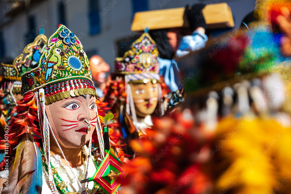 Dancers with masks and traditional costumes celebrate the festivity of the Virgen del Carmen in the square of Paucartambo. Cusco Peru. Dancers with masks and traditional costumes celebrate the festivity of the Virgen del Carmen in the square of Paucartambo. Cusco Peru.
