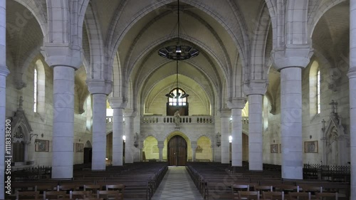 Architectural beauty of a grand cathedral interior featuring tall arches and wooden pews, Eglise de Saint Maurice, Châtillon-sur-Loire, Centre, France photo