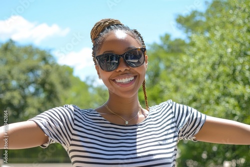 On a brown background, a beautiful black woman is taking a selfie with her phone in hand