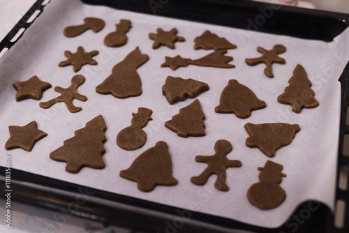 Christmas cookies on a baking sheet before baking.