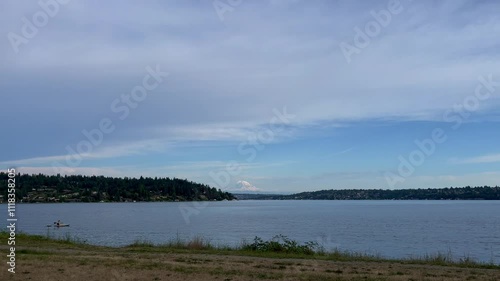 Person in kayak on Lake Washington with Mount Rainier in background