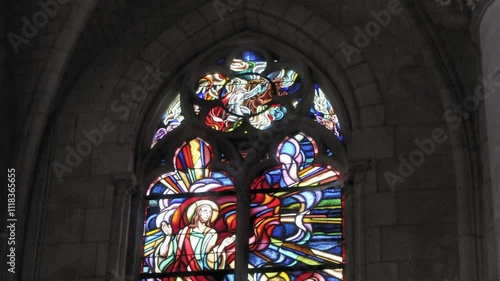 Stained glass window depicting divine figures in a historic church, Eglise de Saint Maurice, Châtillon-sur-Loire, Centre, France photo