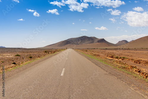 Long road through the Moroccan desert along the Atlas Mountains
