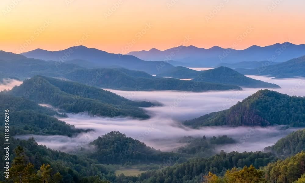 Stunning Misty Mountain Landscape at Sunrise with Soft Pastel Sky Stunning Misty Mountain Landscape at Sunrise with Soft Pastel Sky