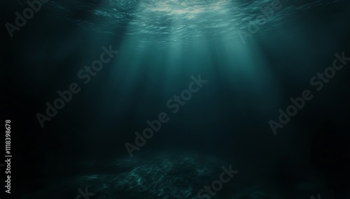 Mysterious underwater scene with sunbeams piercing the deep dark ocean.