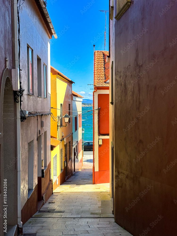 Fototapeta premium Sunny colourful street. Old buildings in the small town