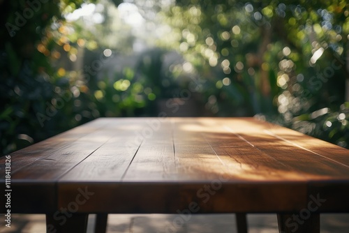 A wooden table in a lush garden setting with soft, blurred greenery in the background.