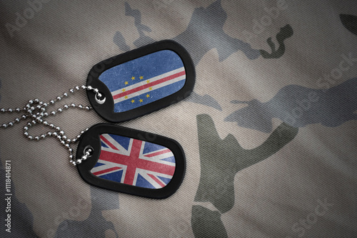 army blank, dog tag with national flag of cape verde and great britain on the khaki texture background. military concept. photo