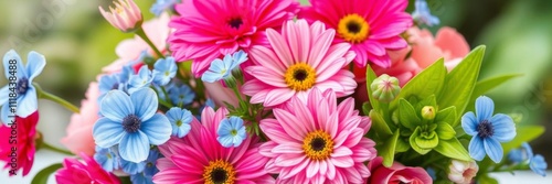 A stunning blue flower arrangement featuring vibrant pink blooms in the center, nature, pink flowers, beautiful